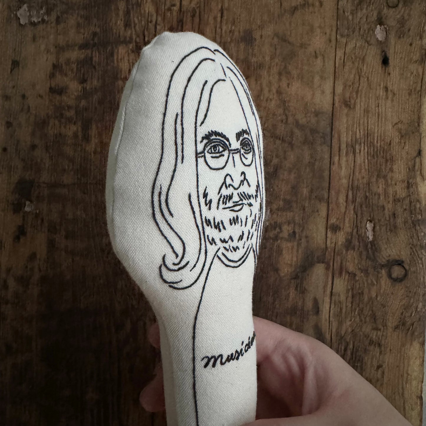 rattle of great human - John Lennon